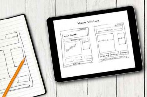 website wireframe sketch on digital tablet screen
